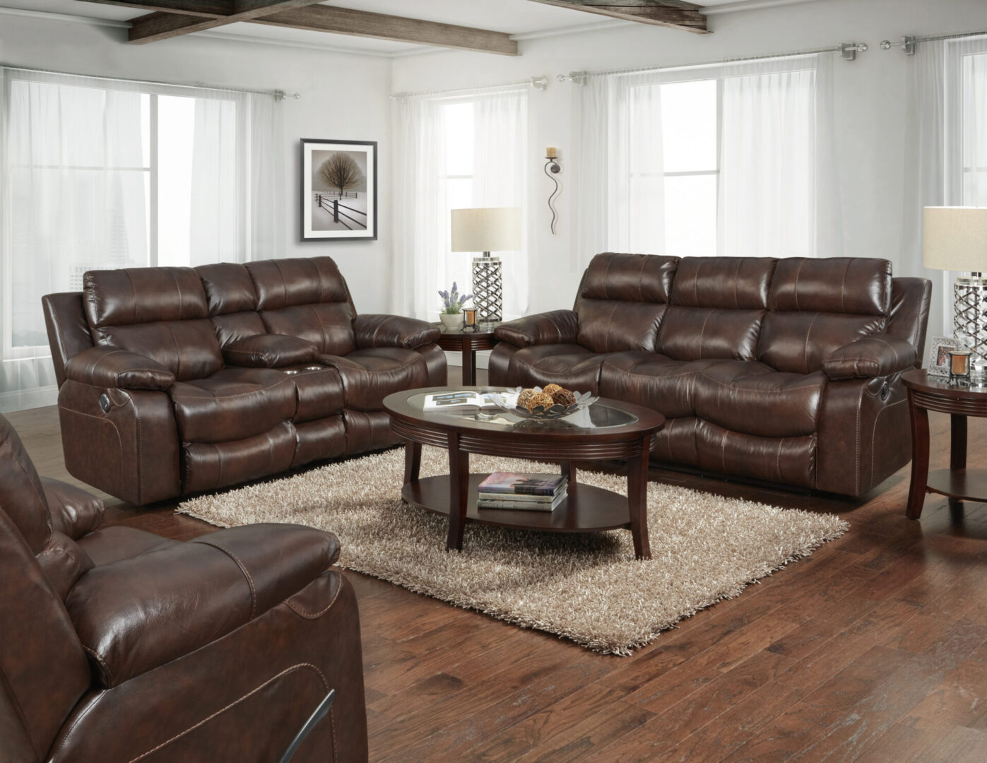 A living room with brown leather furniture and a coffee table.